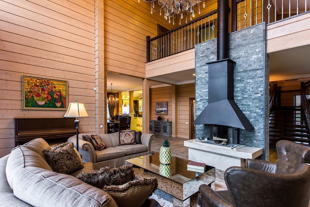 This is an example of a country formal open concept living room in Moscow with a standard fireplace, brown walls, a stone fireplace surround and no tv.