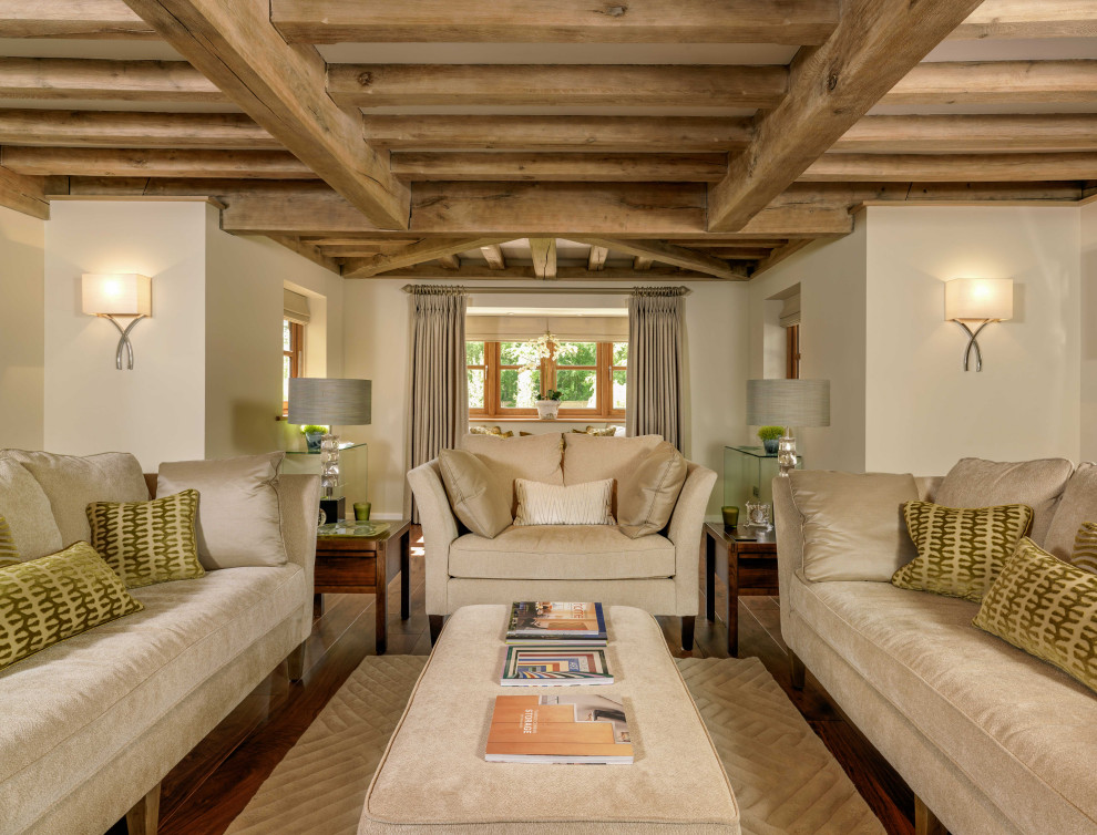 Inspiration for a rural living room in Kent with white walls, dark hardwood flooring, brown floors and exposed beams.
