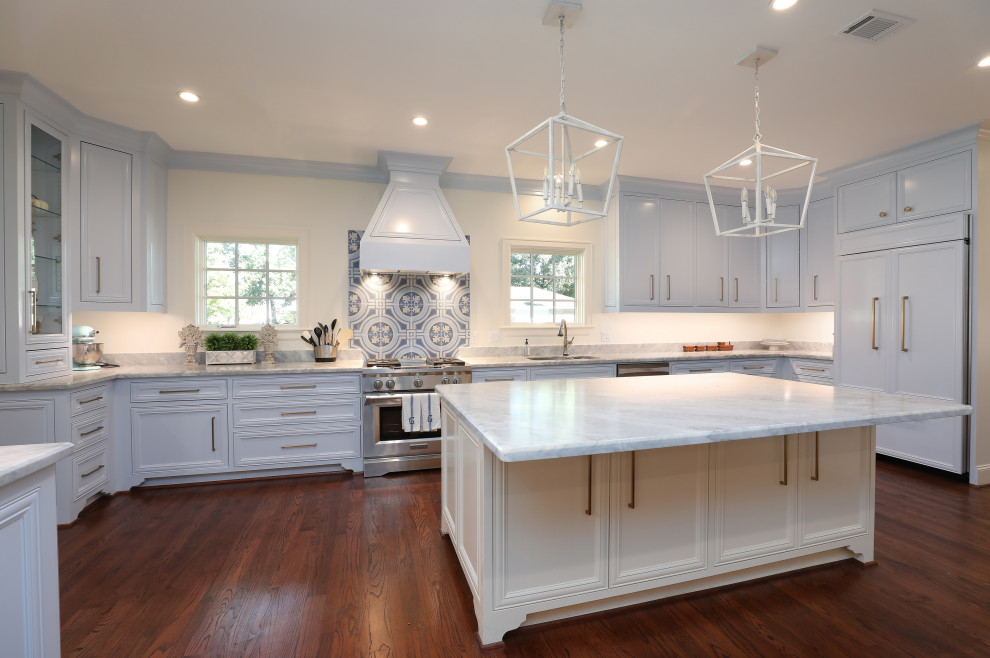 Inspiration for a large transitional kitchen in Houston with beaded inset cabinets, white cabinets, marble benchtops, panelled appliances, dark hardwood floors and with island.