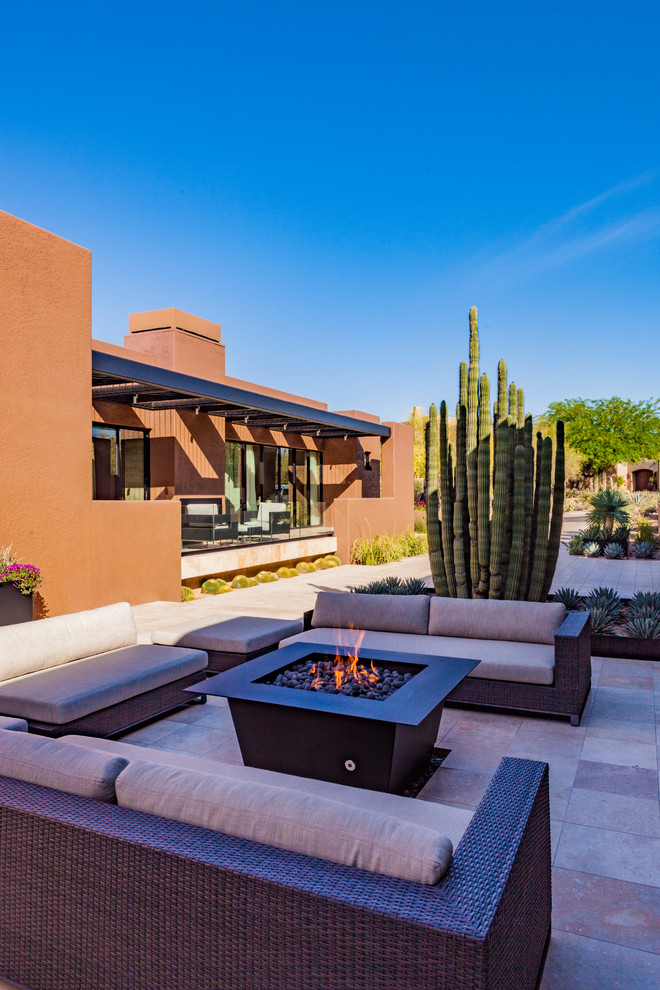 Design ideas for a large contemporary front yard patio with a fire feature and no cover.