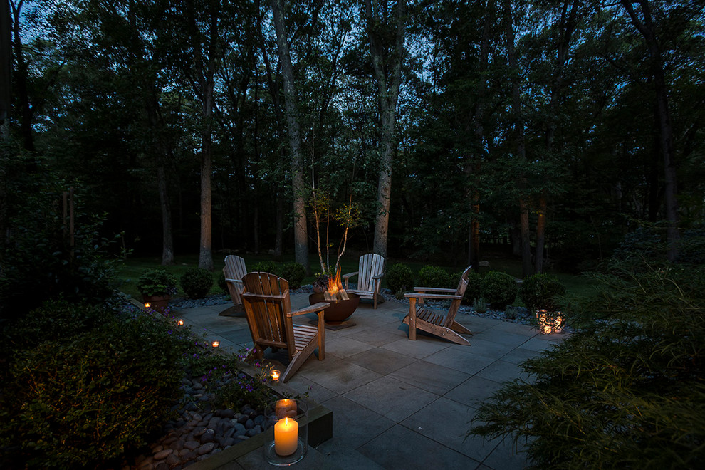Inspiration for a country patio in Providence with a fire feature, natural stone pavers and no cover.