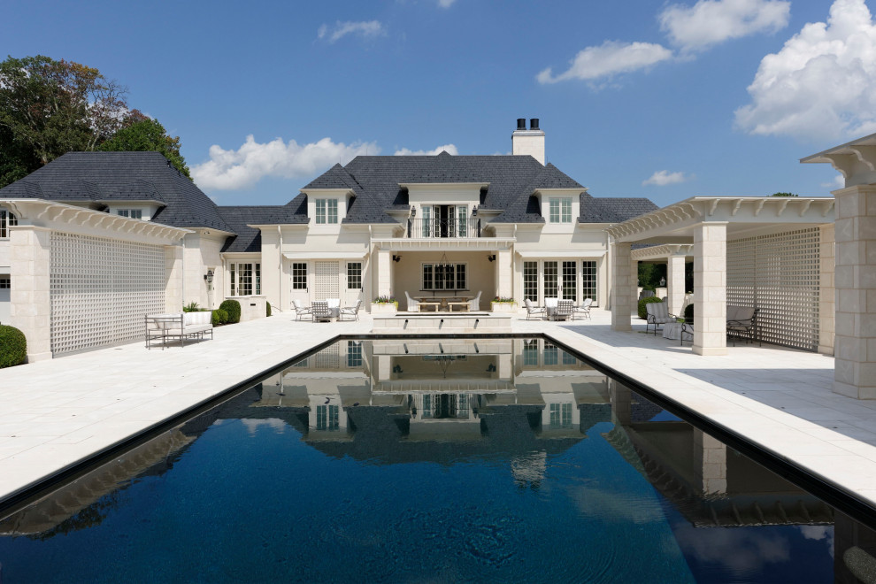 Example of a large transitional courtyard stone and rectangular lap pool design in DC Metro