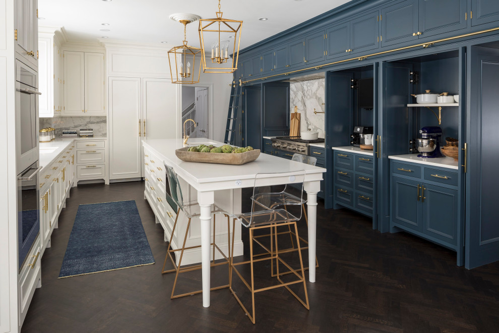 Inspiration for a large transitional u-shaped dark wood floor and brown floor open concept kitchen remodel in Minneapolis with recessed-panel cabinets, blue cabinets, marble countertops, blue backsplash, stone slab backsplash, paneled appliances, an island and white countertops