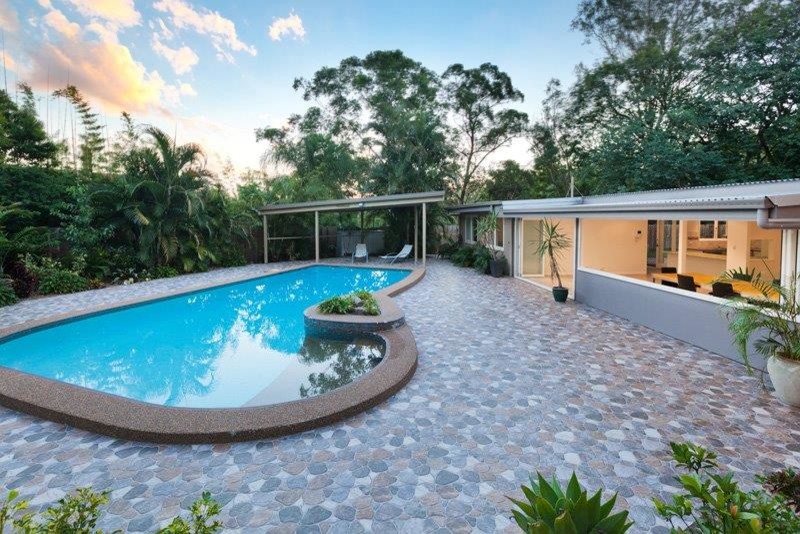 Inspiration for a modern pool in Brisbane with tile.
