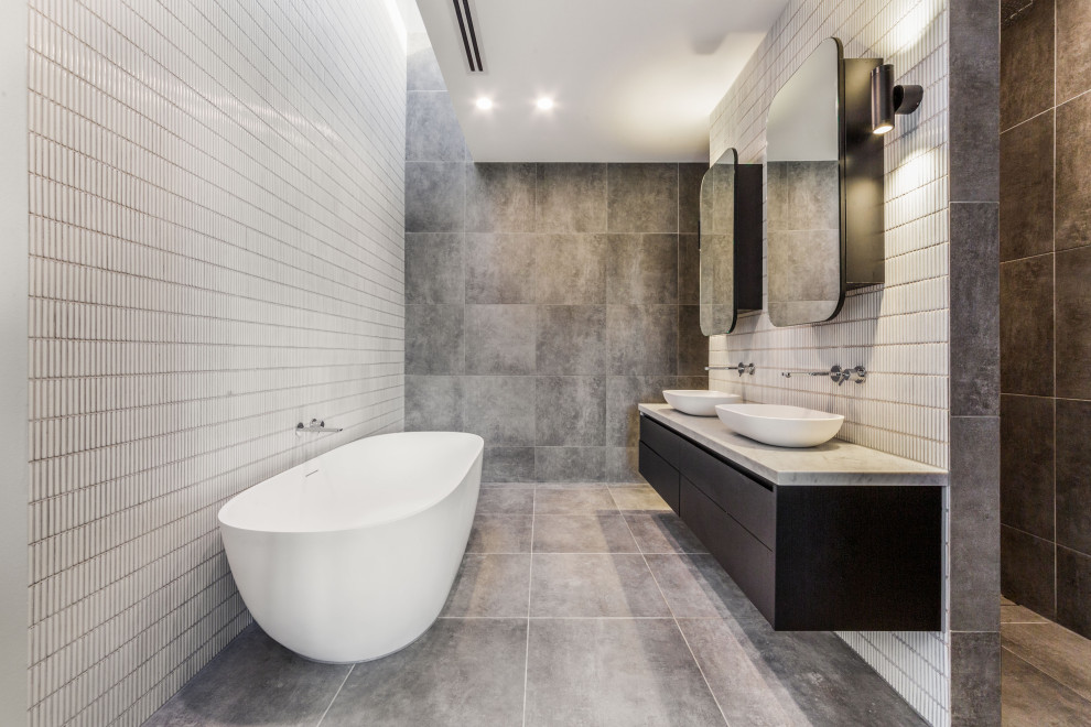 Large trendy master gray tile and mosaic tile porcelain tile, gray floor and double-sink bathroom photo in Melbourne with black cabinets, white walls, a vessel sink, marble countertops, gray countertops and a floating vanity