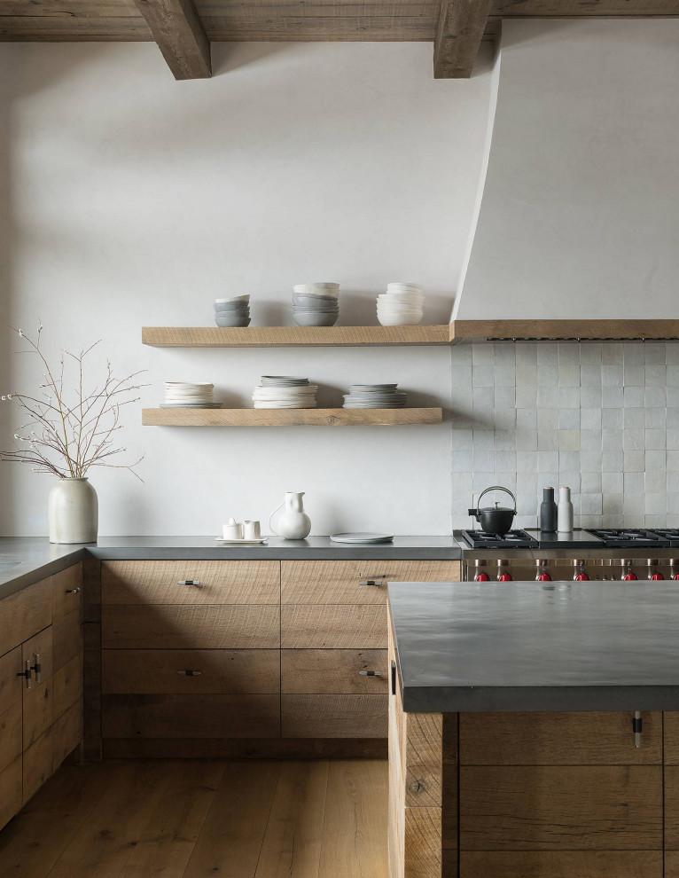 Example of a large trendy l-shaped light wood floor and brown floor open concept kitchen design in Columbus with an undermount sink, flat-panel cabinets, light wood cabinets, quartzite countertops, stainless steel appliances, an island and gray countertops