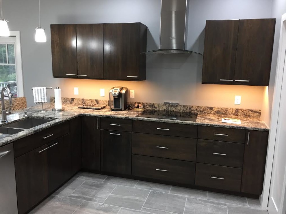 Mid-sized transitional l-shaped porcelain tile and gray floor eat-in kitchen photo in Cedar Rapids with a double-bowl sink, flat-panel cabinets, dark wood cabinets, granite countertops, stainless steel appliances and a peninsula