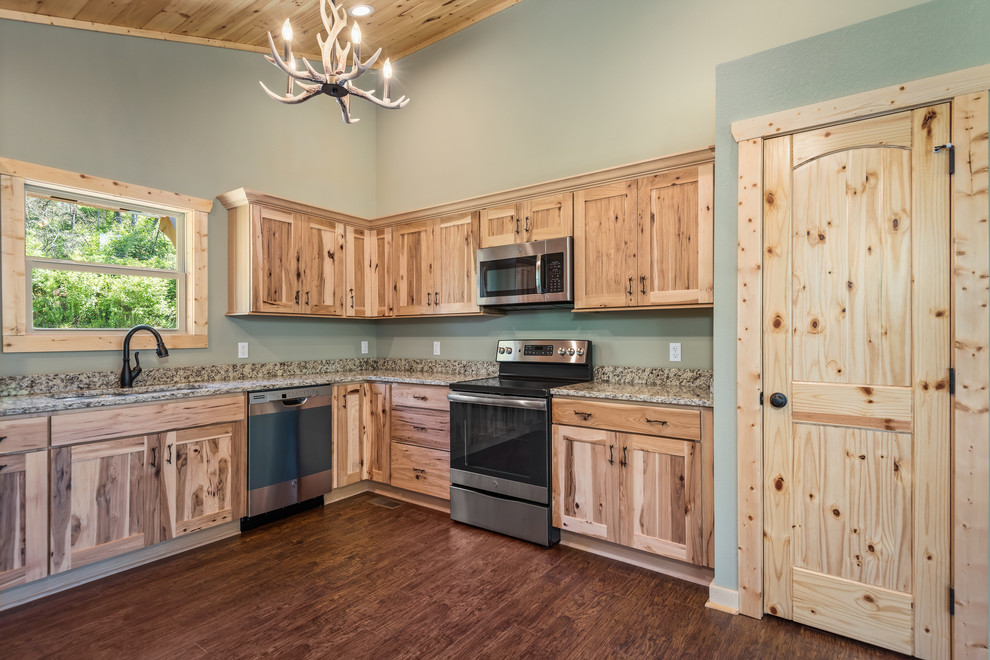 Eat-in kitchen - large rustic u-shaped laminate floor and brown floor eat-in kitchen idea with a double-bowl sink, recessed-panel cabinets, light wood cabinets, granite countertops, multicolored backsplash, stainless steel appliances, no island and multicolored countertops