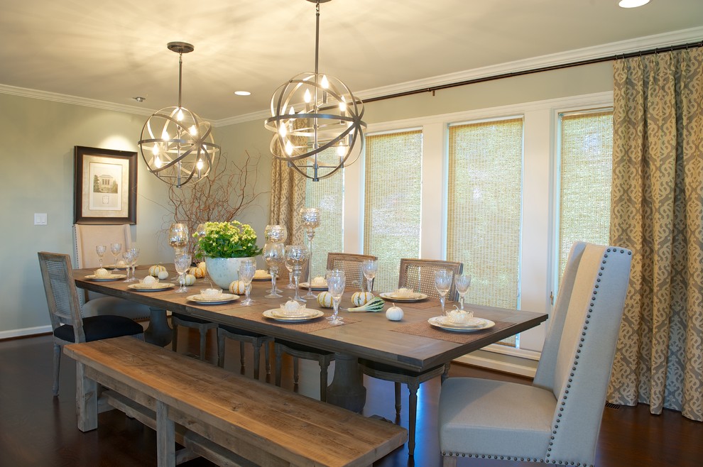 Transitional dining room in Portland with dark hardwood floors and beige walls.