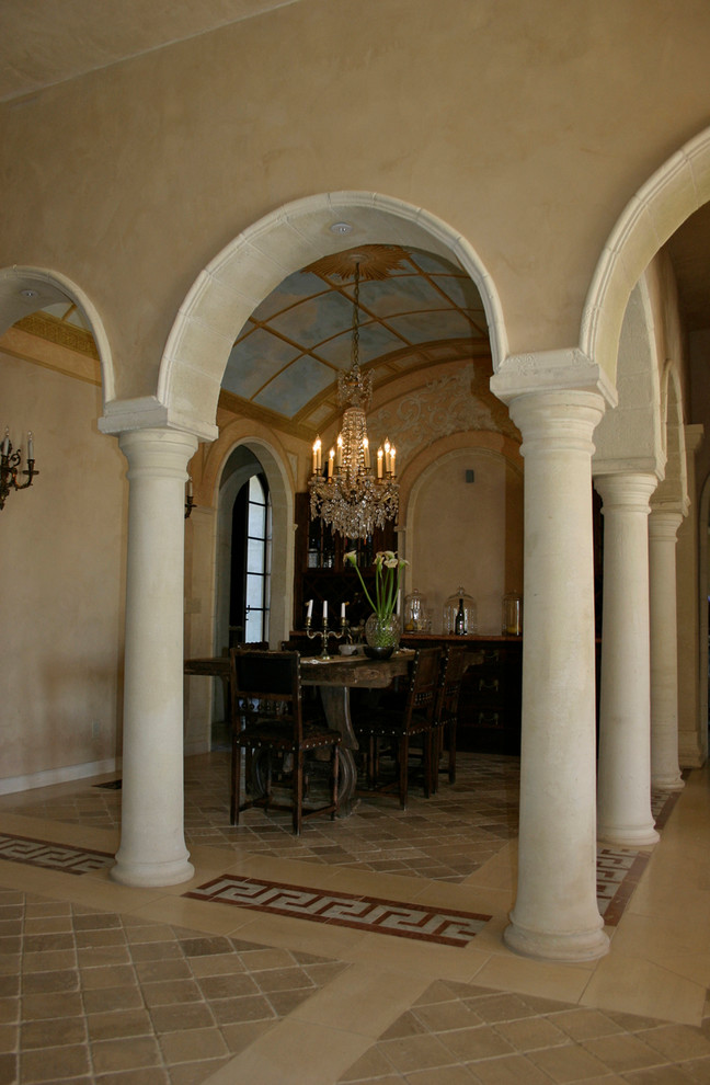 This is an example of a mid-sized mediterranean open plan dining in San Francisco with beige walls and ceramic floors.