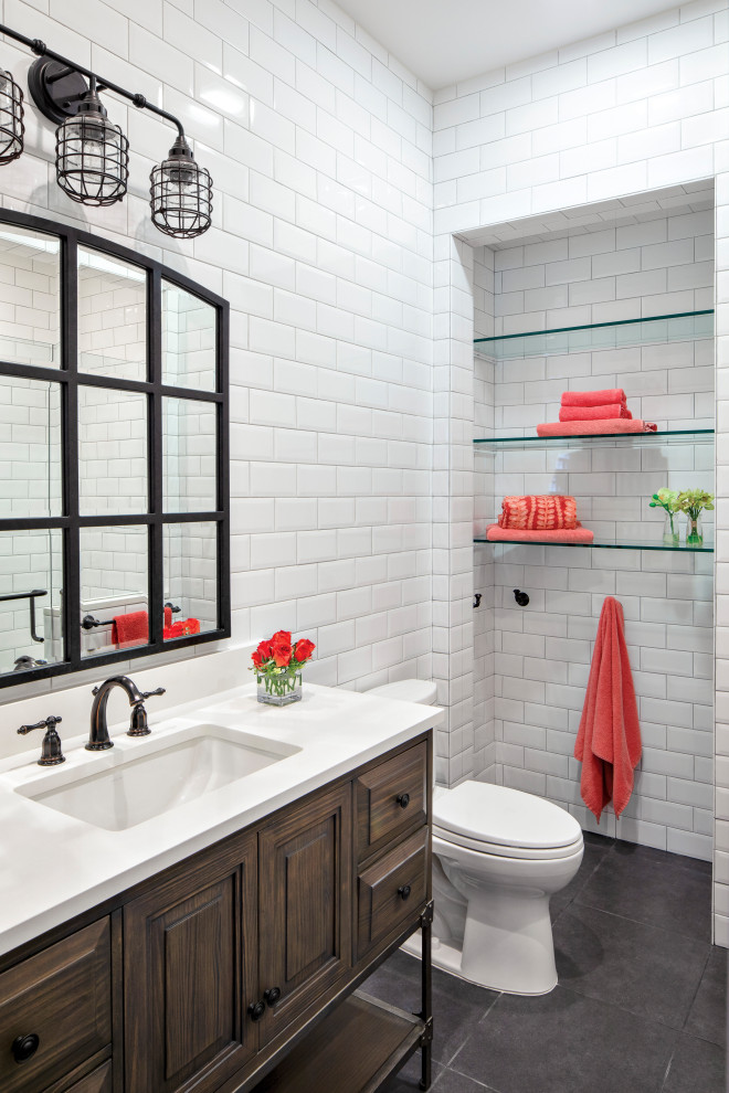 Inspiration for a mid-sized beach style kids bathroom in Miami with raised-panel cabinets, dark wood cabinets, white tile, subway tile, porcelain floors, an undermount sink, engineered quartz benchtops, grey floor and white benchtops.