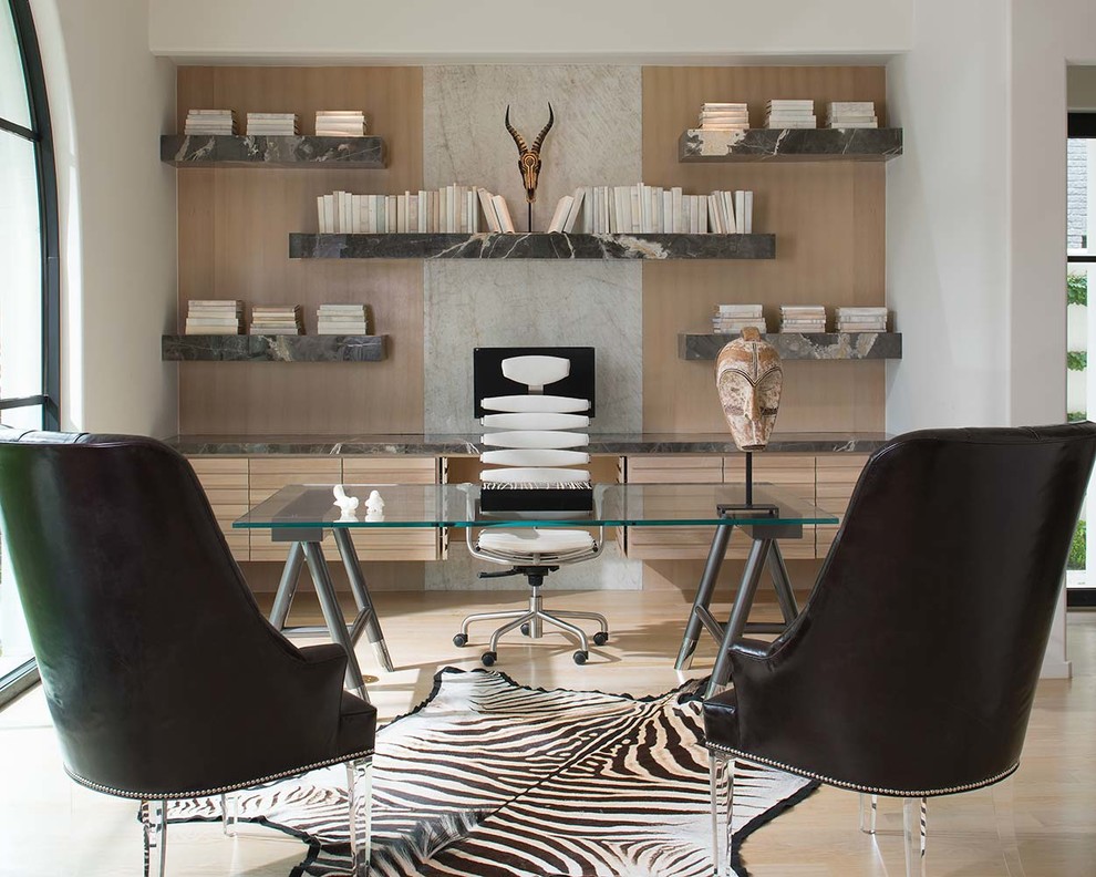 Inspiration for a mid-sized contemporary home office in Dallas with a library, no fireplace, a freestanding desk, beige floor, white walls and light hardwood floors.