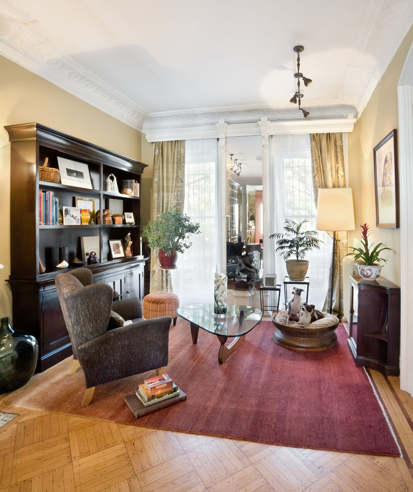 This is an example of a small traditional enclosed living room in New York with beige walls.
