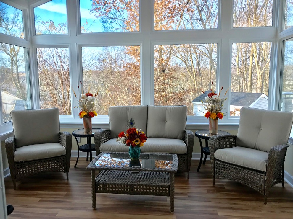 Photo of a mid-sized contemporary sunroom in Baltimore with vinyl floors, no fireplace, a standard ceiling and brown floor.