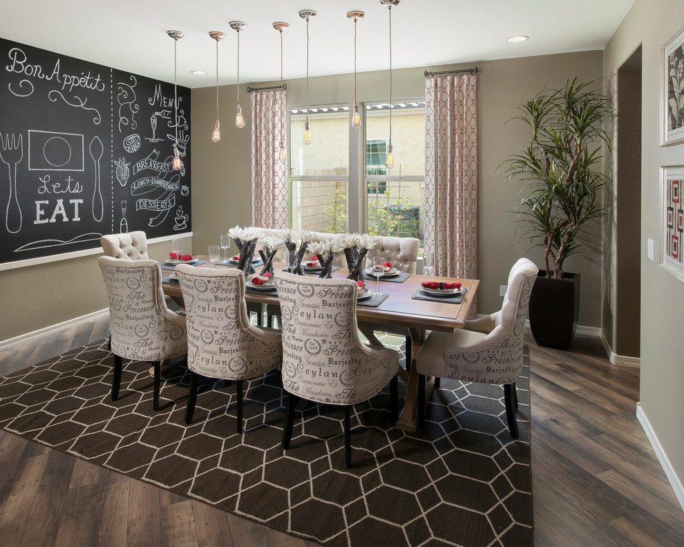 Photo of a transitional dining room in Phoenix with dark hardwood floors and beige walls.