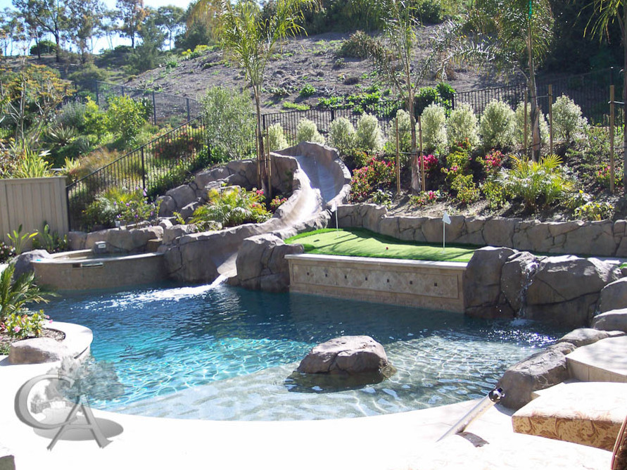 This is an example of a beach style pool in Orange County.