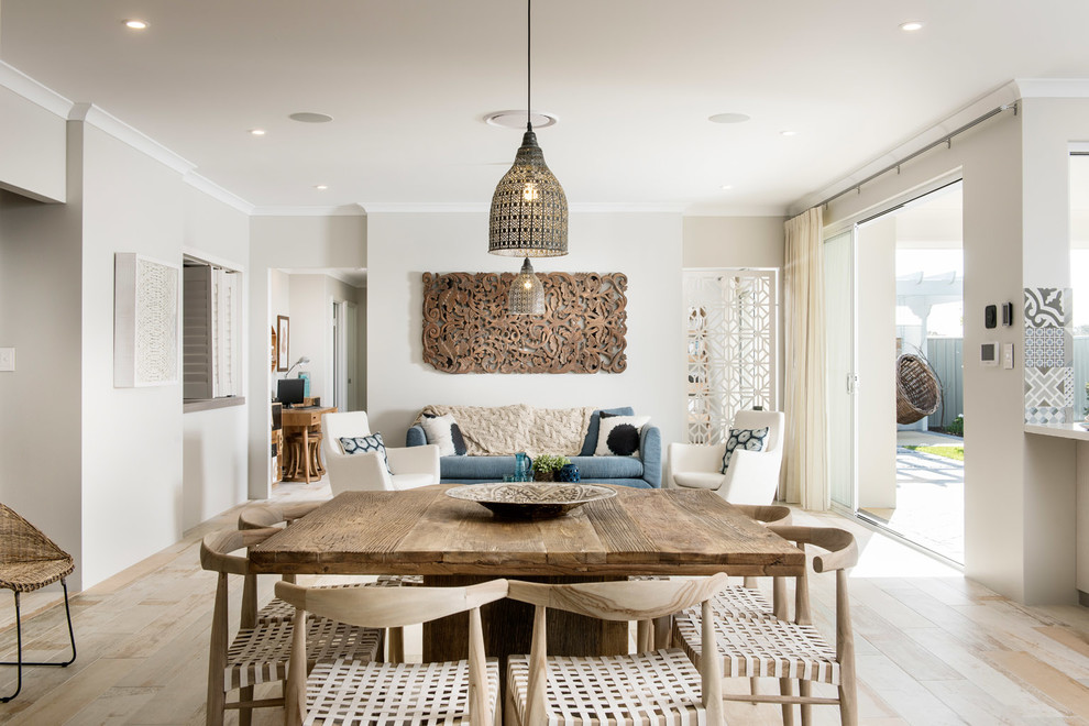 Design ideas for a beach style open plan dining in Perth with grey walls and light hardwood floors.