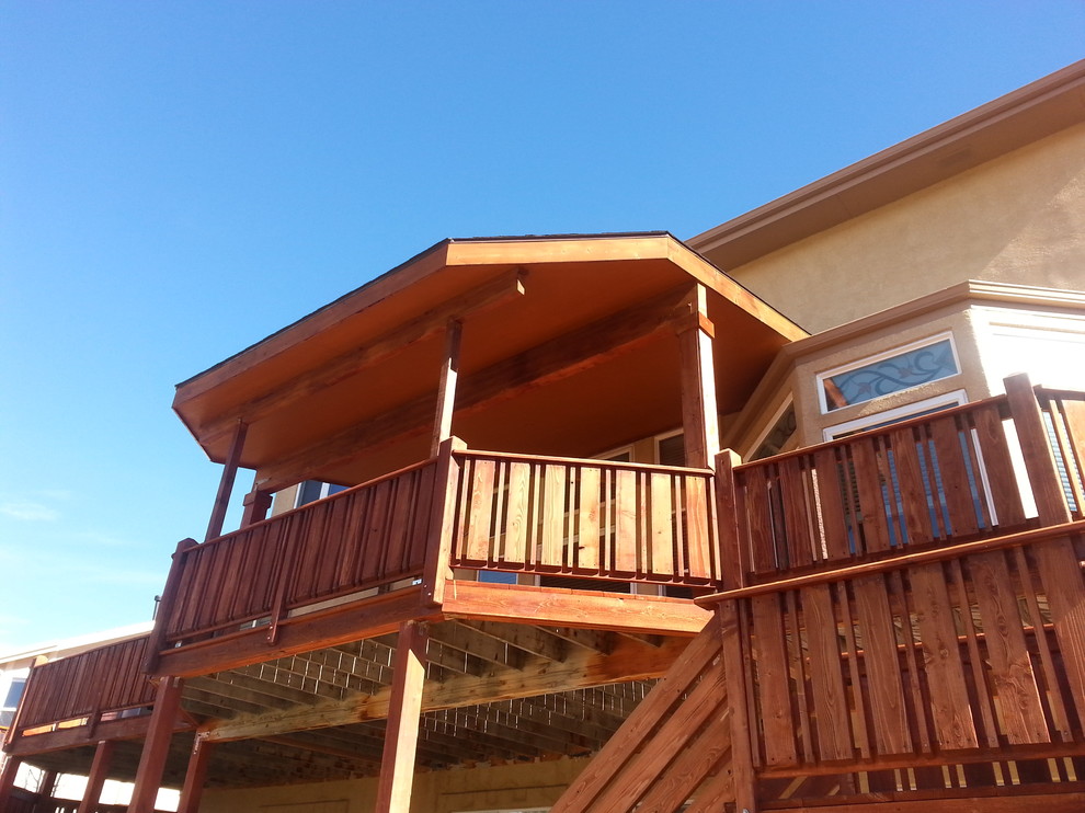 Deck - mid-sized transitional backyard deck idea with an awning