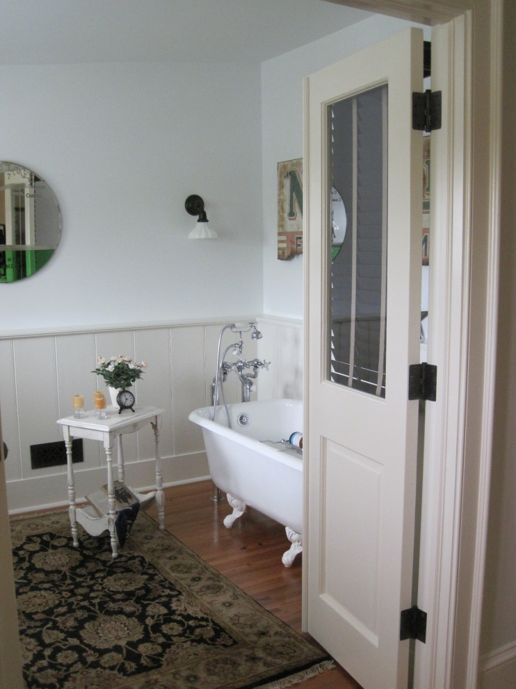 Mid-sized 3/4 bathroom in DC Metro with a claw-foot tub and planked wall panelling.