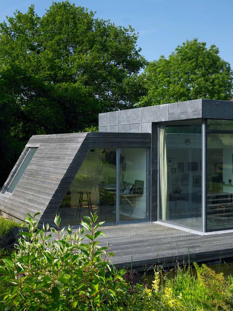 Photo of a contemporary exterior in London with wood siding.
