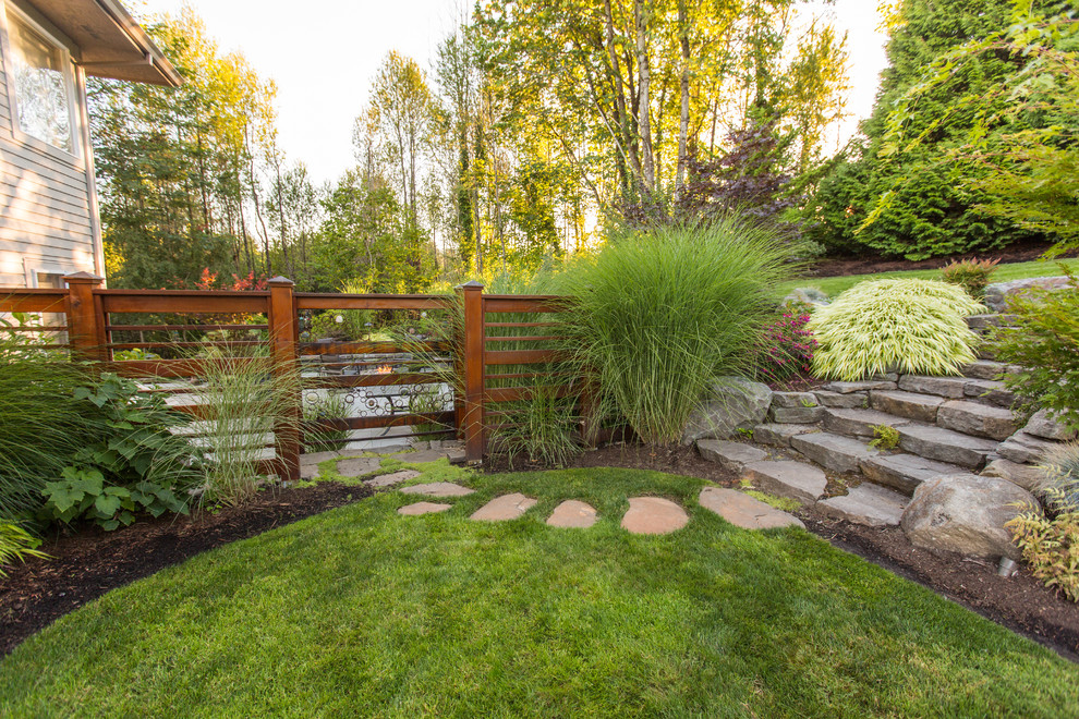 Design ideas for a traditional full sun garden in Portland with a garden path and natural stone pavers.