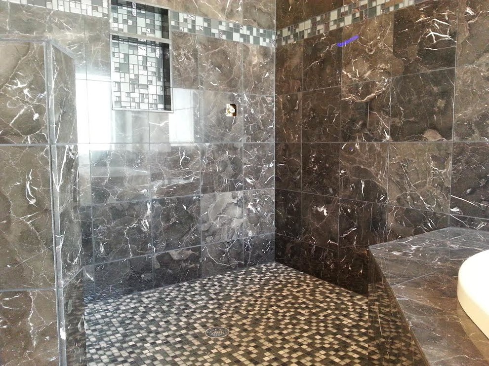 Example of a transitional 3/4 brown tile corner shower design in Denver