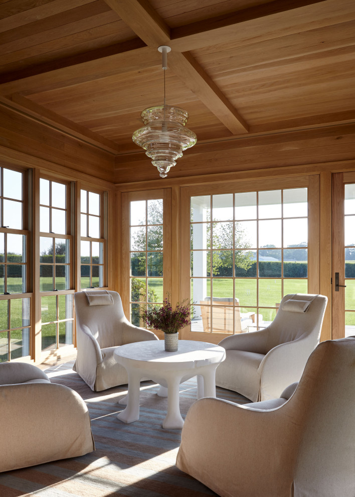 This is an example of a beach style sunroom in New York with a standard ceiling.