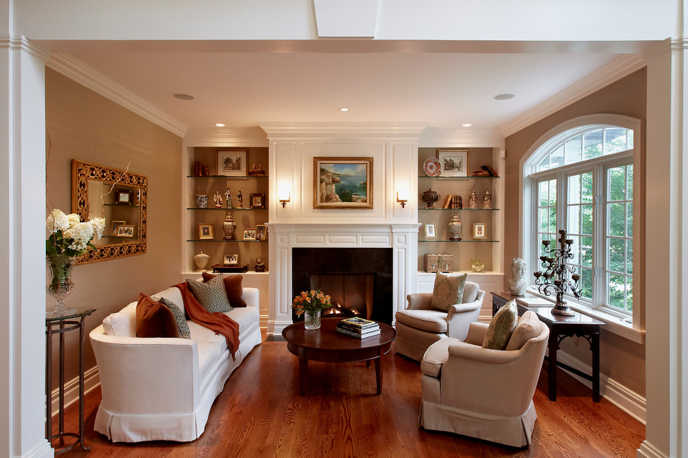 Inspiration for a mid-sized traditional living room in New York with brown walls.