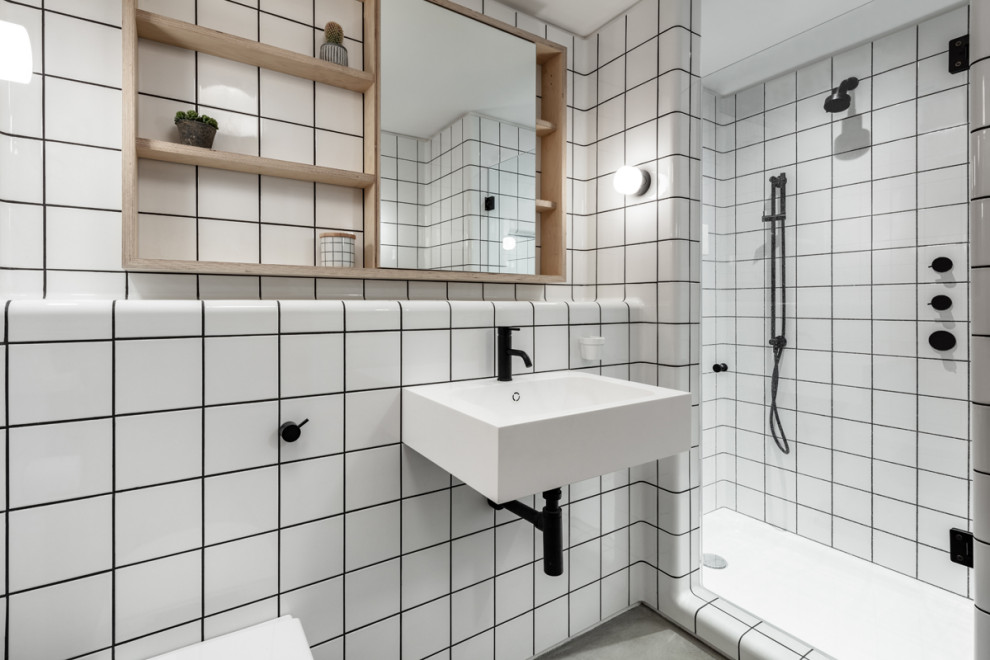 Design ideas for a medium sized urban bathroom in London with a wall mounted toilet, white tiles, white walls, a wall-mounted sink, tiled worktops, white worktops and a single sink.