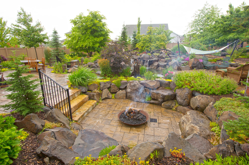 This is an example of a traditional patio in Seattle with a fire feature.