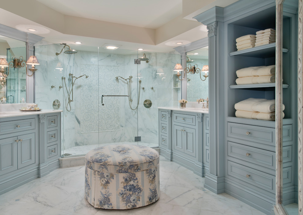 Photo of a master bathroom in Miami with beaded inset cabinets, blue cabinets, an alcove shower, beige walls, marble floors, an undermount sink and marble benchtops.