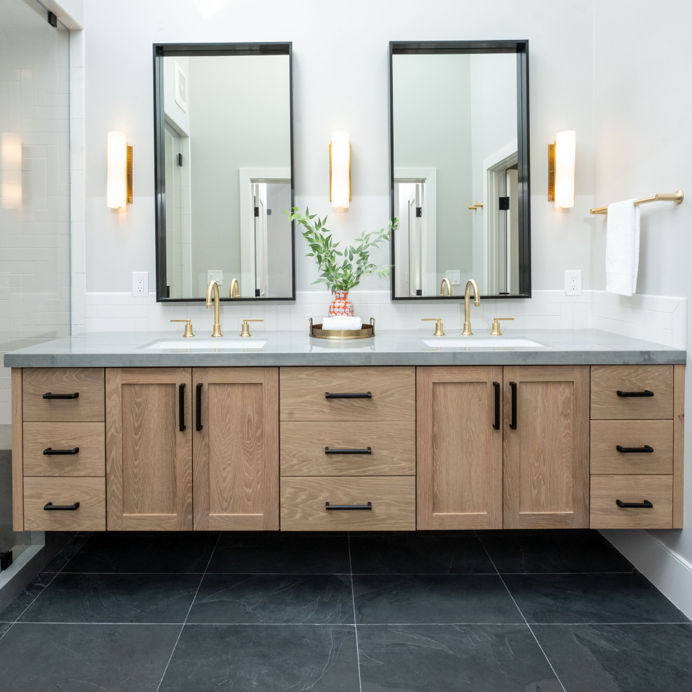 Design ideas for a large transitional wet room bathroom in San Francisco with shaker cabinets, medium wood cabinets, a one-piece toilet, white tile, ceramic tile, white walls, slate floors, an undermount sink, engineered quartz benchtops, black floor, a hinged shower door, grey benchtops, a shower seat, a double vanity and a floating vanity.