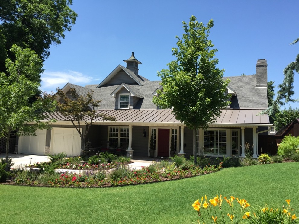 Large transitional gray two-story mixed siding exterior home photo