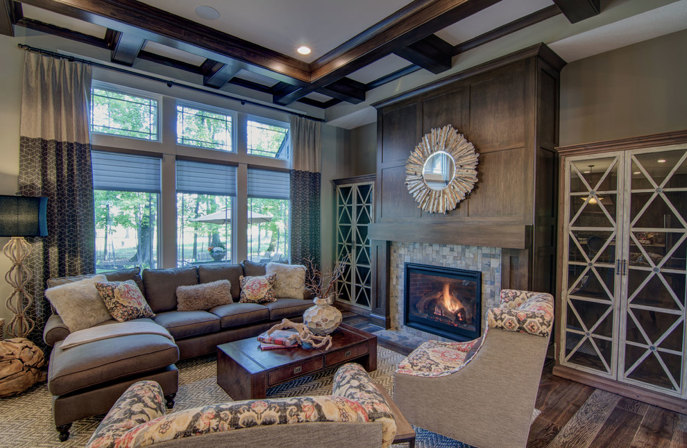 Mid-sized arts and crafts formal open concept living room in Indianapolis with medium hardwood floors, a standard fireplace and a brick fireplace surround.