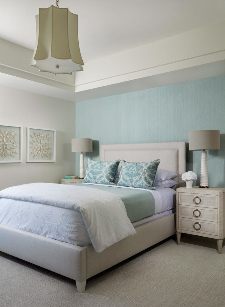 Mid-sized transitional guest bedroom in Miami with blue walls, carpet and beige floor.