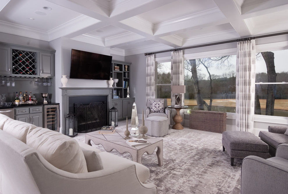 Large traditional open concept family room in Atlanta with grey walls, a standard fireplace, a stone fireplace surround, a wall-mounted tv and white floor.