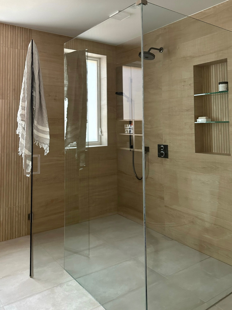 Inspiration for a mid-sized modern master bathroom in Seattle with flat-panel cabinets, blue cabinets, a curbless shower, blue tile, wood-look tile, porcelain floors, an integrated sink, engineered quartz benchtops, grey floor, a hinged shower door, white benchtops, a niche, a double vanity and a floating vanity.