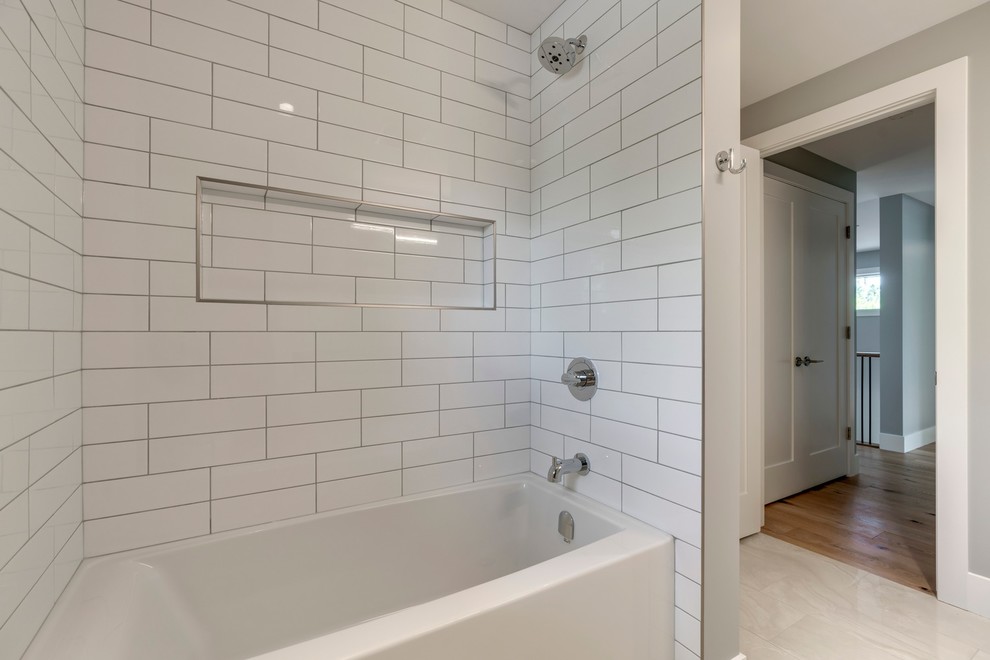 Inspiration for a small transitional white tile and ceramic tile ceramic tile and beige floor corner shower remodel in Calgary with shaker cabinets, white cabinets, a one-piece toilet, gray walls, an undermount sink, quartzite countertops and gray countertops
