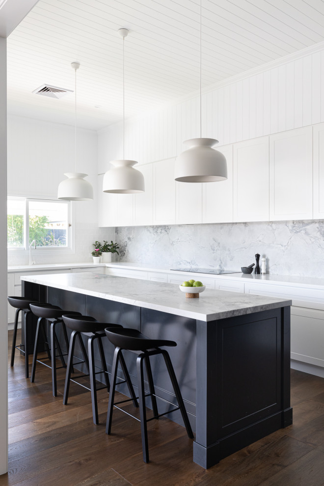 Inspiration for a large contemporary l-shaped kitchen in Brisbane with an integrated sink, shaker cabinets, white cabinets, marble benchtops, grey splashback, marble splashback, black appliances, dark hardwood floors, with island, brown floor, grey benchtop and timber.