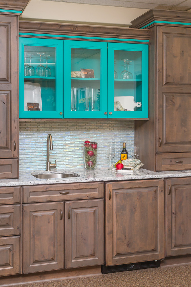 Small eclectic galley wet bar in Other with an undermount sink, raised-panel cabinets, distressed cabinets, quartz benchtops, white splashback and glass tile splashback.