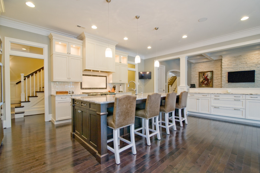 This is an example of a large transitional kitchen in Baltimore with dark hardwood floors and with island.