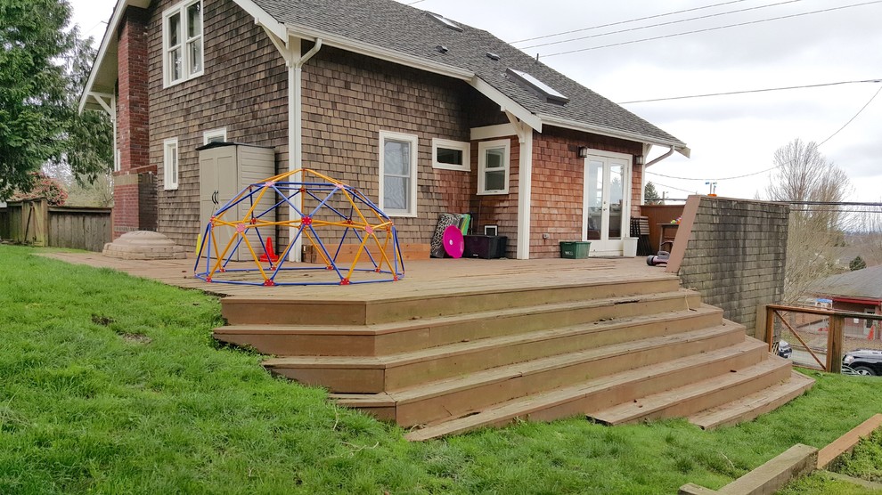 Inspiration for a mid-sized craftsman backyard deck remodel in Seattle with a pergola