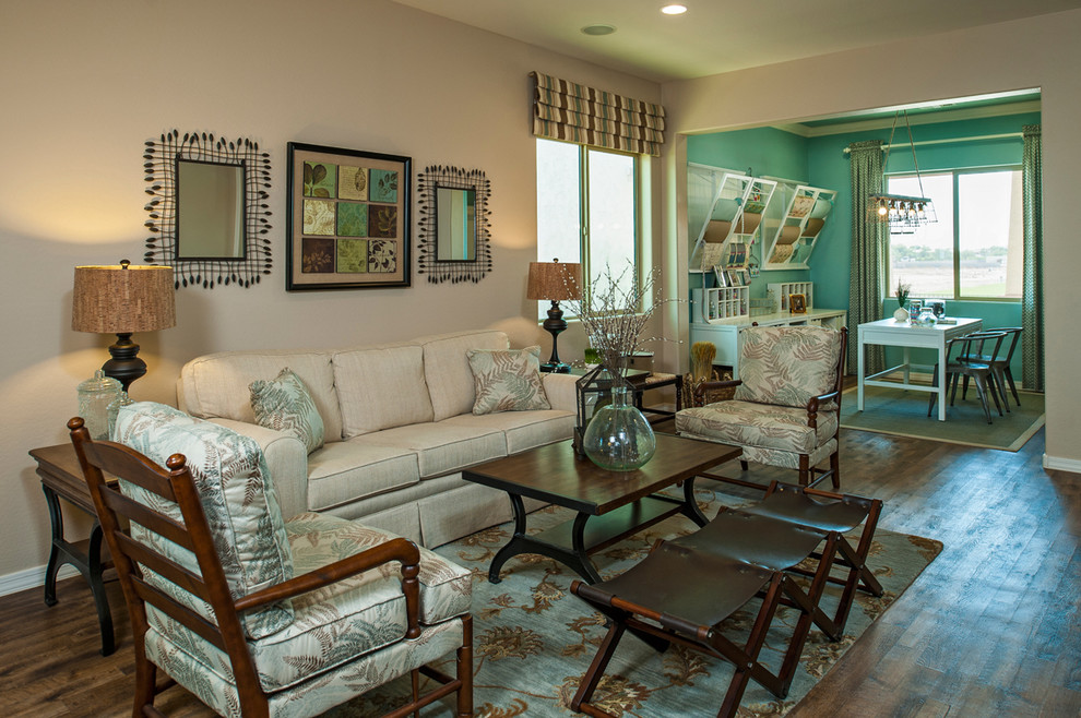 Traditional open concept family room in Phoenix with beige walls and dark hardwood floors.
