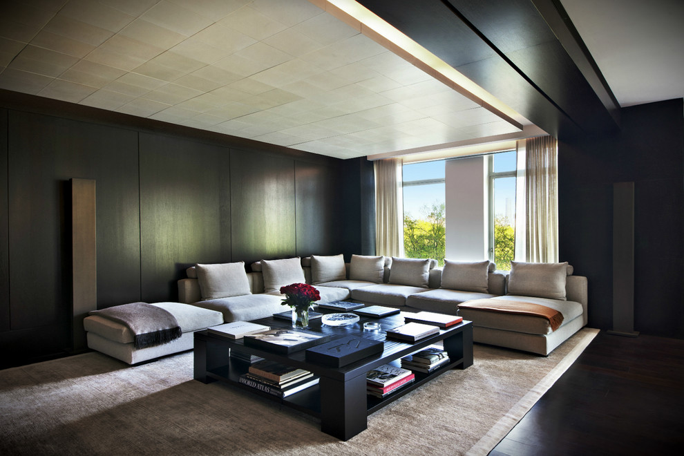 Contemporary living room in New York with black walls and dark hardwood floors.