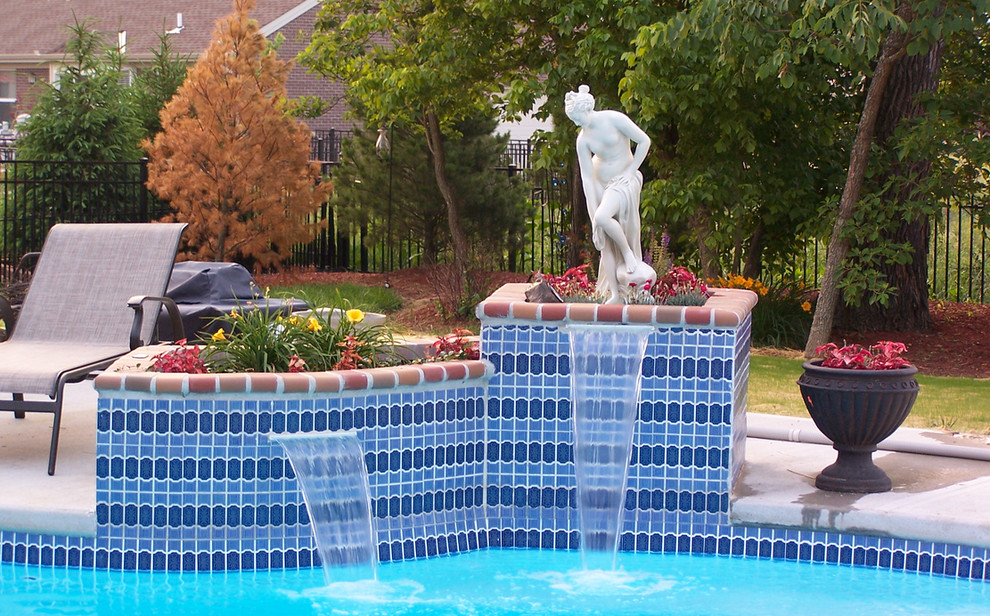 Example of a mid-sized backyard concrete and custom-shaped natural pool fountain design in Cincinnati