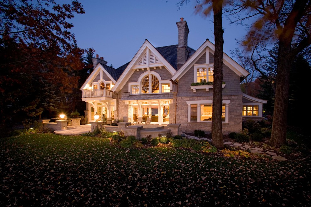 Design ideas for a large traditional two-storey exterior in Minneapolis with wood siding.
