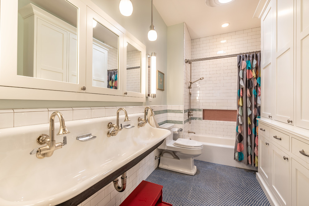 Transitional bathroom in San Francisco with recessed-panel cabinets, white cabinets, an alcove tub, a shower/bathtub combo, green tile, orange tile, white tile, subway tile, green walls, mosaic tile floors, a trough sink, blue floor and a shower curtain.