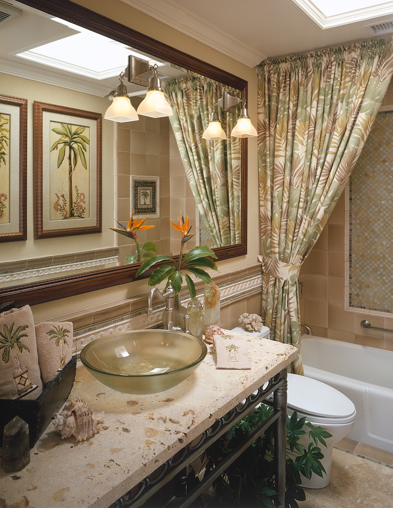Inspiration for a mid-sized tropical bathroom in San Diego with a vessel sink, open cabinets, an alcove tub, a shower/bathtub combo, brown tile, multi-coloured tile, ceramic tile, beige walls, ceramic floors, terrazzo benchtops, brown floor, a shower curtain and beige benchtops.