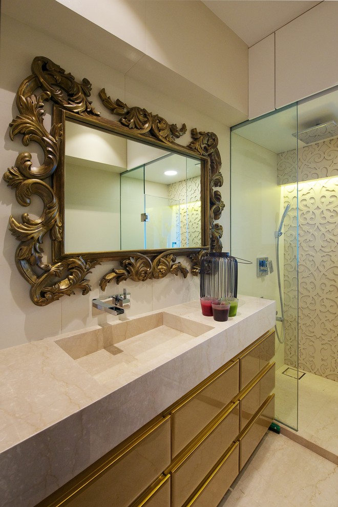 Expansive contemporary master bathroom in Mumbai with marble benchtops and marble floors.