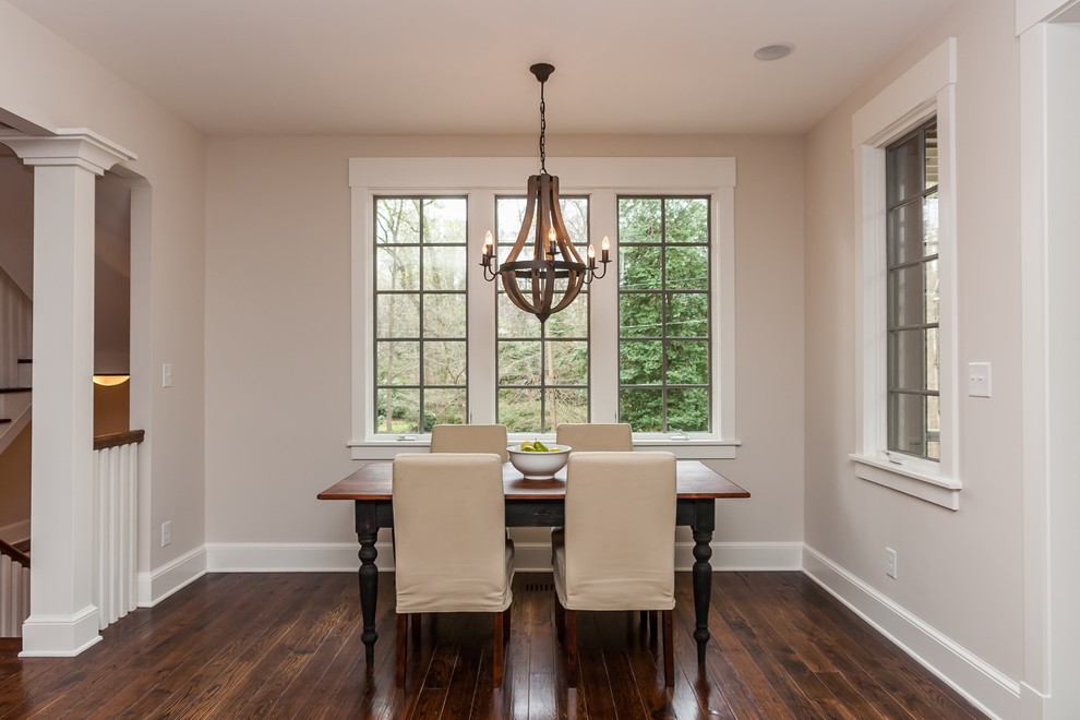 Photo of a small traditional kitchen/dining combo in Raleigh with beige walls and dark hardwood floors.